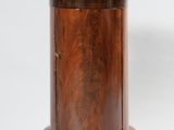 an image of a small wooden table with a round top