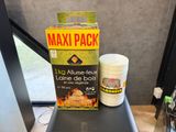 a box of food sitting on a table next to a cup
