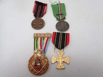 three medals and a medal on a white surface