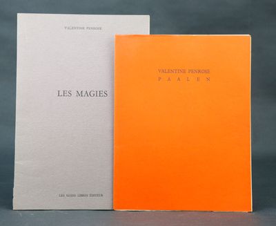 a couple of books sitting on top of a table next to each other