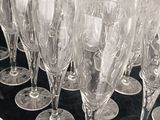 a lot of empty wine glasses sitting on a table
