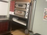 an image of a kitchen with a stove and oven