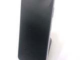 a cell phone that is sitting on top of a stand