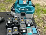many makita power tools on the ground