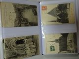 a person holding an open book with pictures of buildings on it