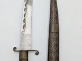 two knives that are sitting next to each other on a table