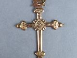 an image of a cross with a bird on top of it