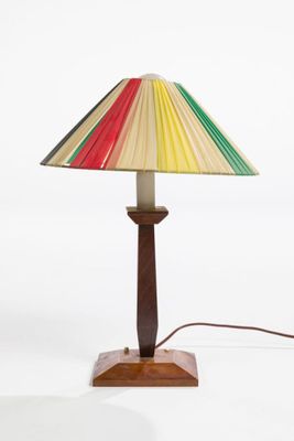 a lamp that has a colorful shade on it