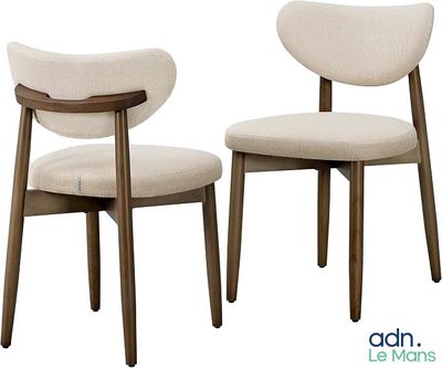 two chairs that are sitting next to each other on a white background