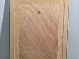 painting of a wooden frame with a triangle on it