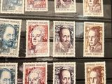 the stamps are on display in a glass case on the table