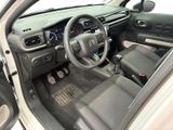 a picture of a car interior with a steering wheel and dashboard