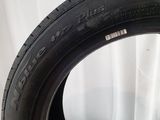 a close up of a tire on a white surface