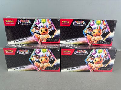 three boxes of pokemon trading cards sitting on top of a table
