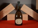 a bottle of wine that is sitting on a table