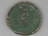 an old coin with a man riding a horse on it ' s back