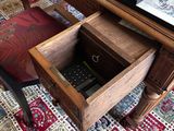a small table with a remote control in it