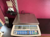 a scale that is sitting on a table in a room