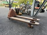 a skateboard that is sitting on the ground in the parking lot
