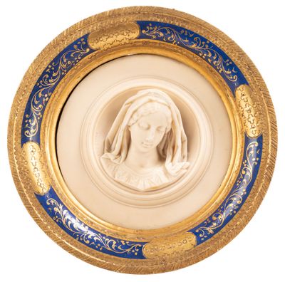 an image of a gold and blue plate with a picture of a woman in a veil