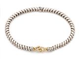 a silver and gold bracelet with a knot clasp