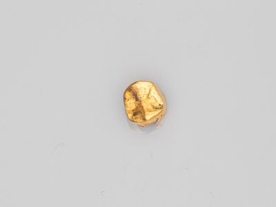 une pépite d'or en forme de visage