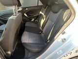 a silver car with black seats in the back of it