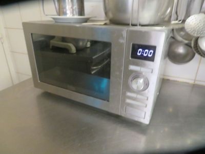an image of a toaster oven with a digital clock on it