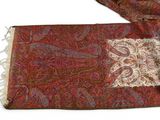 a red scarf with a paisley design on it