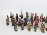 a lot of figurines that are on a white surface