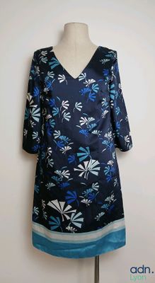 the dress is blue and white with blue flowers on it
