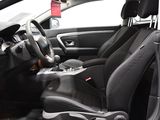 a picture of the interior of a car with a steering wheel