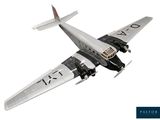 a model of a plane flying in the sky