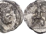 a silver coin with an image of a man and a woman on it