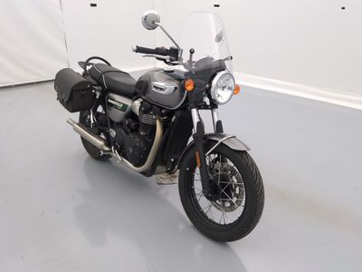 a black motorcycle that is parked in a room