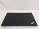 a black laptop computer sitting on a white surface