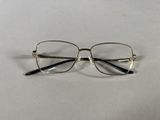 a close up of a pair of glasses on a white surface