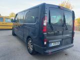 a black van that is parked in a parking lot