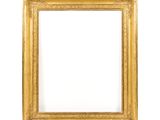 a gold picture frame on a white background