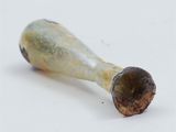 a small piece of food that is sitting on a white surface