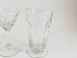 two wine glasses sitting next to each other on a table