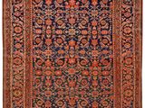 tapis persan ancien à motifs bleus et rouges