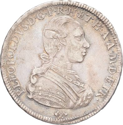 une pièce d'argent représentant le portrait d'un homme de profil