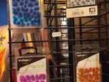 a display of different colored beads in a store