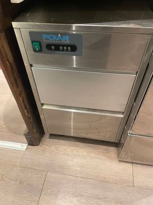a stainless steel dishwasher in the corner of a kitchen