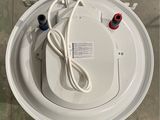 an overhead view of a white fire hydrant with a cord connected to it
