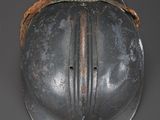 a metal helmet with a rope around the neck
