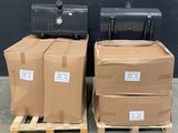 two boxes of luggage sitting on pallets in front of a black wall
