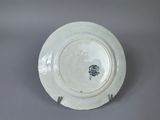 a white plate with a black and white design on it