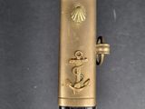 a black and gold cane with a gold anchor on it